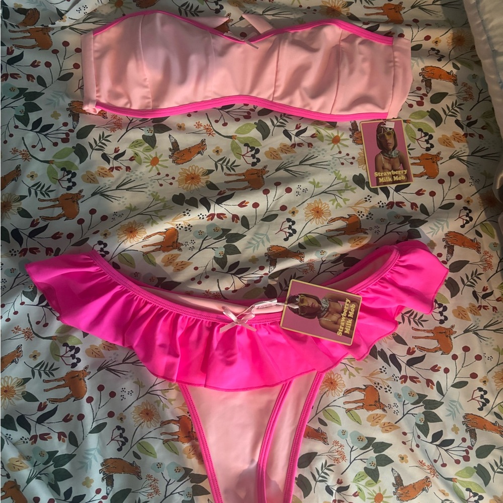 Strawberry MilkMob pink ruffle swimsuit top bottoms were sold